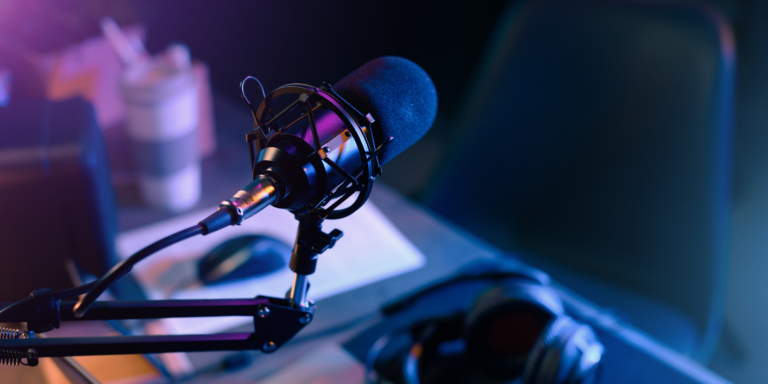 Podcast set up with microphone and dim lights